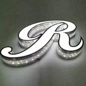3D illuminated acrylic letters with perforated metal sides, featuring bright LED backlighting shining through the front and thousands of micro-perforations on the sides to create a modern star-glow effect. Premium black contour, white acrylic face, and industrial-style perforated design ideal for restaurants, bars, offices, and tech brands seeking high-impact signage.