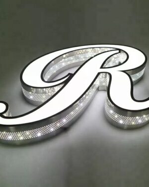 3D illuminated acrylic letters with perforated metal sides, featuring bright LED backlighting shining through the front and thousands of micro-perforations on the sides to create a modern star-glow effect. Premium black contour, white acrylic face, and industrial-style perforated design ideal for restaurants, bars, offices, and tech brands seeking high-impact signage.