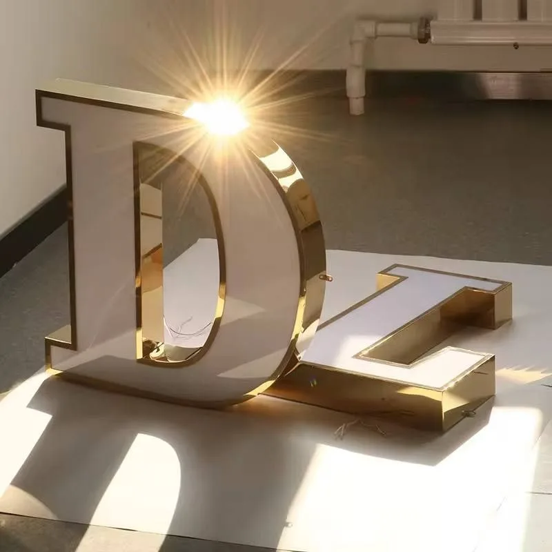 Gold and white illuminated 3D channel letters for shopfront signage - cast acrylic with real gold vinyl sides.