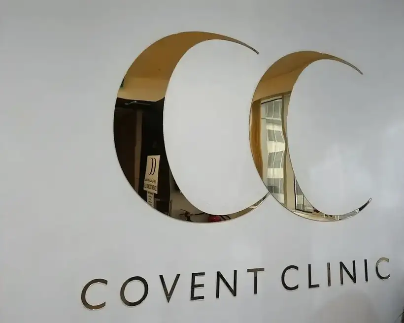 Mirror gold CC logo and letters on the reception wall at Covent Clinic, Dublin, made by AdsyUp