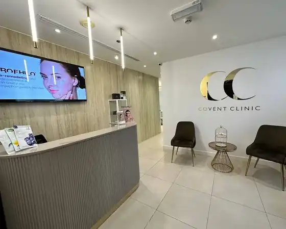 Covent Clinic reception in Dublin with the mirror gold CC logo wall
