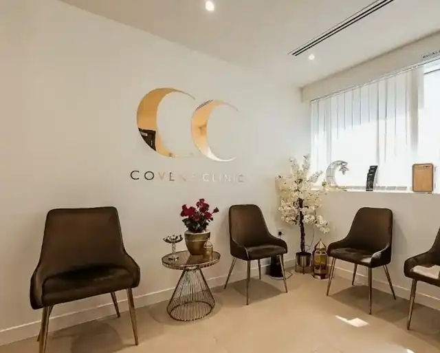 Covent Clinic waiting room in Dublin with the mirror gold CC logo wall by AdsyUp