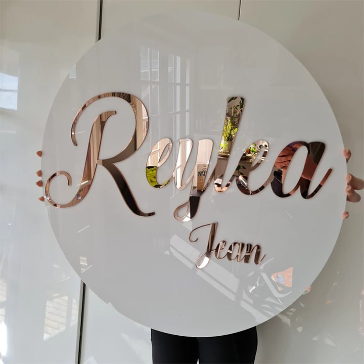 Round white acrylic panel with rose gold mirror script lettering