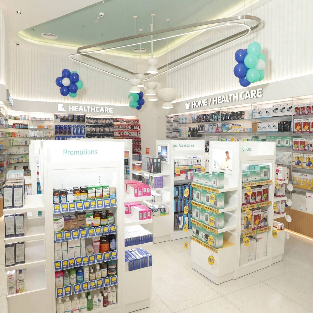 Aster Pharmacy interior with Healthcare and Home Health Care wall signs