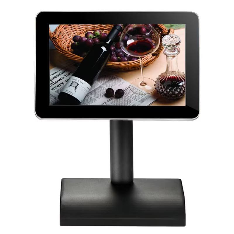 Front view of a 10.1 inch landscape digital menu display on a black stand showing example content